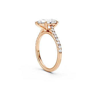 #R67214 - Pear Solitaire Shoulder Engagement Ring With French Pave Band
